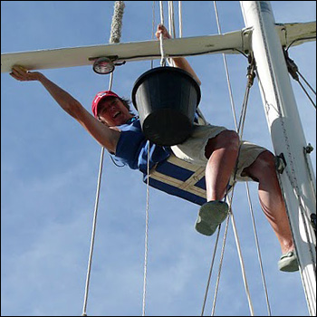 Gwen Hamlin up the mast in bosun chair 